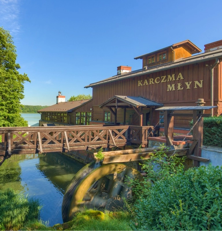 Karczma Młyn restaurant with a functioning water wheel